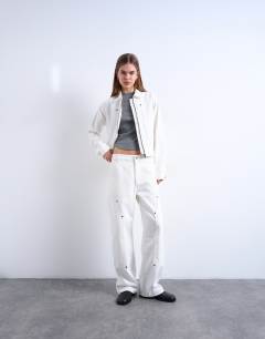 Model wearing Denim utility jacket in ecru