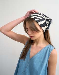 Model wearing Denim v-neck mini shift dress in bleach