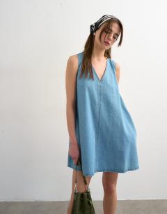 Model wearing Denim v-neck mini shift dress in bleach