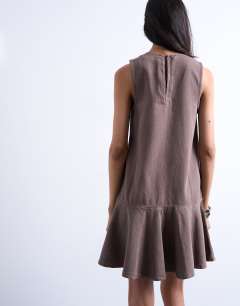 Model wearing Denim v neck peplum mini dress in brown