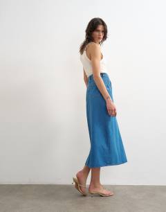 Model wearing Denim wrap circle midi skirt in mid blue
