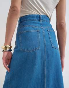 Model wearing Denim wrap circle midi skirt in mid blue