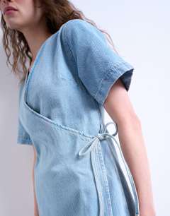 Model wearing Denim wrap mini dress in bleach
