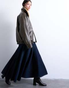 Model wearing Denim yoke front maxi skirt in indigo rinse