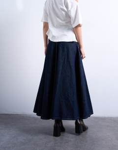 Model wearing Denim yoke front maxi skirt in indigo rinse