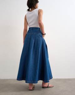 Model wearing Denim yoke pleated maxi skirt in rich blue