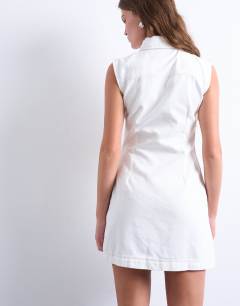 Model wearing Denim zip through collar sleeveless mini dress in white