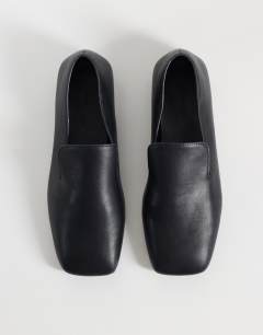 Model wearing Denise slip on flat shoe in black