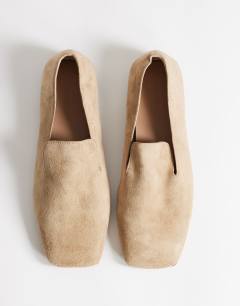 Model wearing Denise slip on flat shoe in taupe