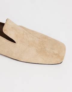 Model wearing Denise slip on flat shoe in taupe