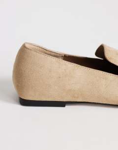 Model wearing Denise slip on flat shoe in taupe