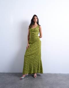 Model wearing Devore occasion twist shoulder midi dress in green
