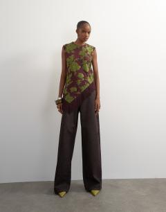 Model wearing Devoure fringe asymmetric top in deep plum
