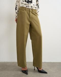 Model wearing Dilan baggy low rise jean in khaki green