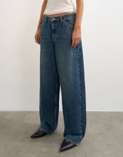 Model wearing Dillan baggy low rise jean in dirty blue