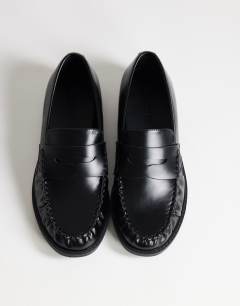 Model wearing Dominic ruched loafer in black