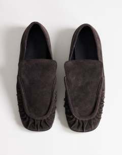 Model wearing Dora real suede ruched loafer in chocolate