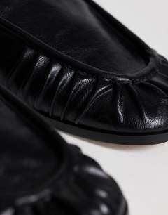 Model wearing Dora ruched loafer in black