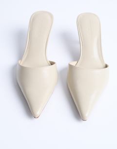 Model wearing Dorota kitten heel pointed mule in cream