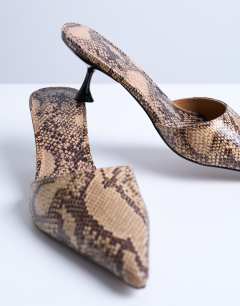 Model wearing Dorota kitten heel pointed mule in snake