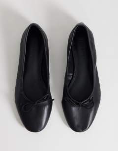Model wearing Dottie block heel ballet shoe in black