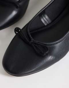 Model wearing Dottie block heel ballet shoe in black