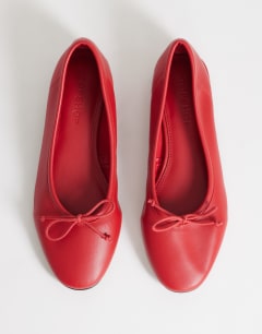 Model wearing Dottie block heel ballet shoe in red