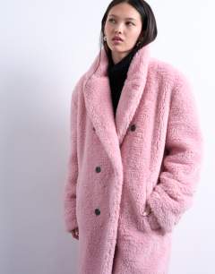 Model wearing Double breasted borg longline coat in pink