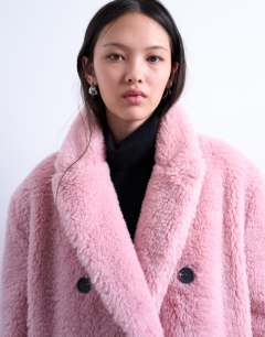 Model wearing Double breasted borg longline coat in pink