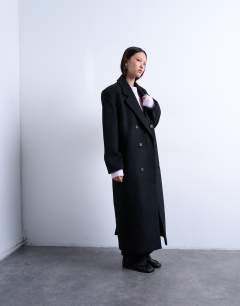 Model wearing Double breasted mensy overcoat with wool in black