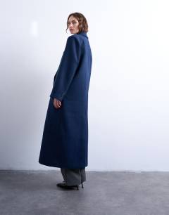 Model wearing Double breasted mensy overcoat with wool in navy