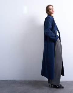 Model wearing Double breasted mensy overcoat with wool in navy