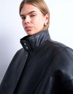 Model wearing Double fronted funnel seam detail bomber in black