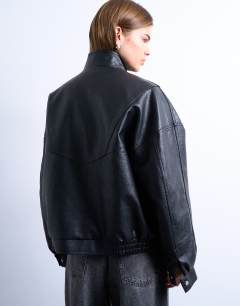 Model wearing Double fronted funnel seam detail bomber in black