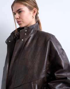 Model wearing Double fronted seam detail bomber in brown