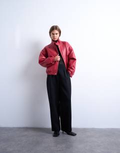 Model wearing Double fronted seam detail bomber in red