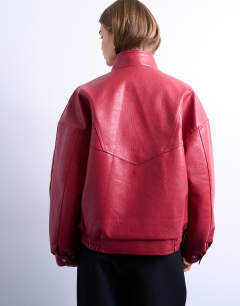 Model wearing Double fronted seam detail bomber in red