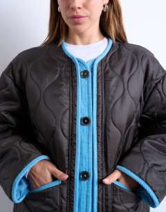 Model wearing Double layer fronted liner jacket in brown