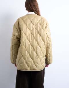 Model wearing Double layer fronted liner jacket in sand