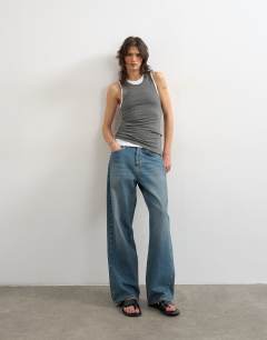 Model wearing Double layer tank top in charcoal