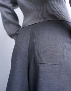 Model wearing Double pleat high rise wide leg trouser in charcoal