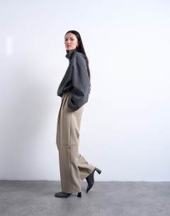 Model wearing Double pleated slouchy trouser in taupe