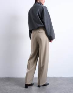 Model wearing Double pleated slouchy trouser in taupe
