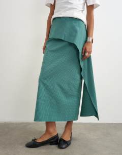 Model wearing Drape detail maxi skirt in green and blue check