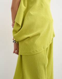 Model wearing Drape detail textured bandeau co-ord top in green