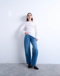 Model wearing Drape neck long sleeve top in white