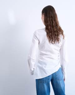 Model wearing Drape neck long sleeve top in white