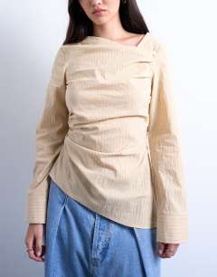 Model wearing Drape neck long sleeve top in yellow stripe