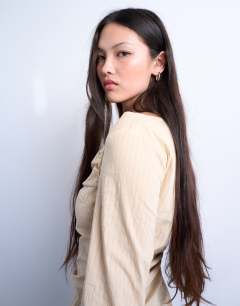 Model wearing Drape neck long sleeve top in yellow stripe