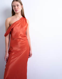 Model wearing Drape neck off shoulder maxi occasion dress in rust